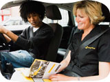 image of an instructor in a car with her pupil