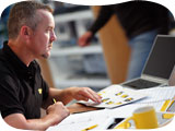 Image of an AA instructor accessing AA driving school support on a laptop