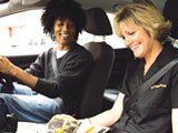Image of an AA driving instructor in a car with her pupil