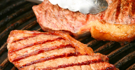 Steak cooking on a barbecue