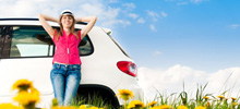 Girl leaning against car