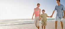 Family walking along beach