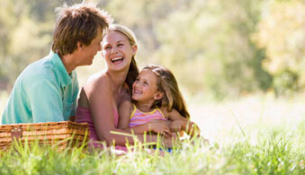 Family picnic in sunny field