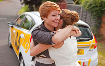 A pupil celebrating passing her test