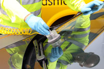 A windscreen being repaired by an AA technician
