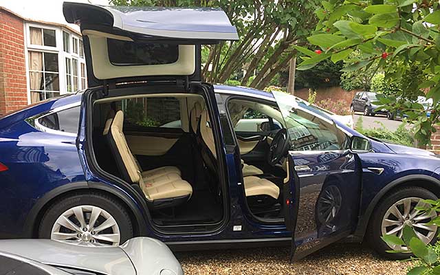 Tesla modelx side doors open