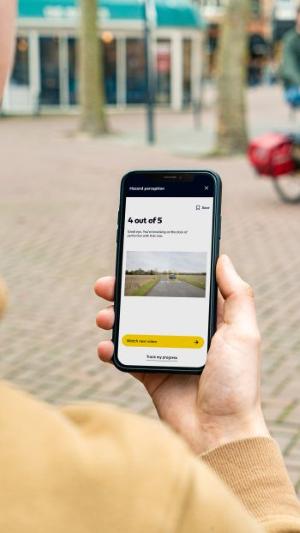 AA Driving School theory test app shown on a mobile phone
