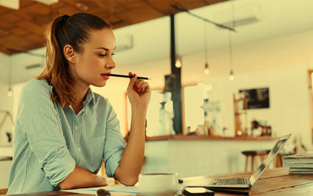 Young woman studying for her theory test