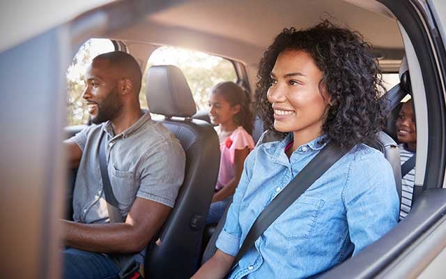 Family in car on road trip Family in car on road trip