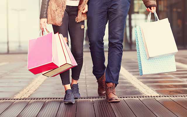 Two people with shopping bags