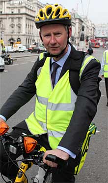 Edmund King, AA president rides an AA bicycle