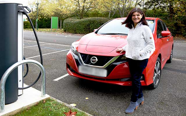 A new Nissan Leaf electric vehicle at a charging point