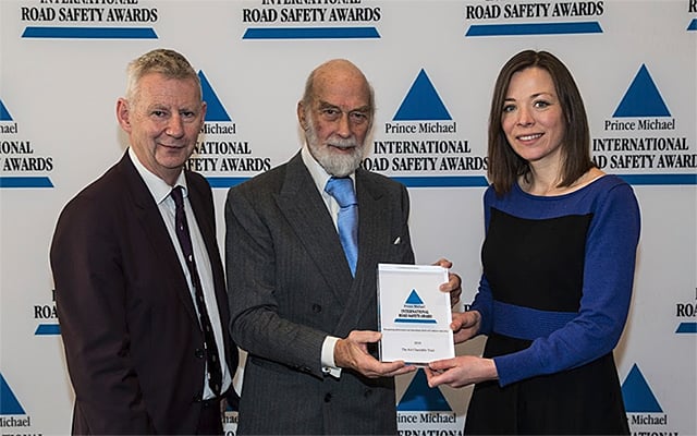 AA Trust Director Edmund King and AA Campaigns Manager Lorna Lee receive an award from Prince Michael of Kent