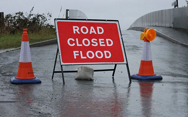 Floods road closed sign
