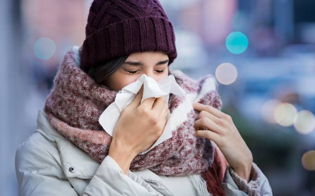 Sneezing woman cold