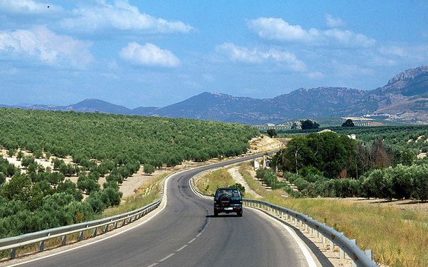 Car driving along road abroad