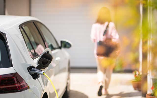 Electric car charging at home in driveway