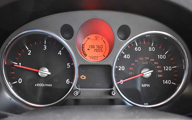 Engine management light lit up on car dashboard