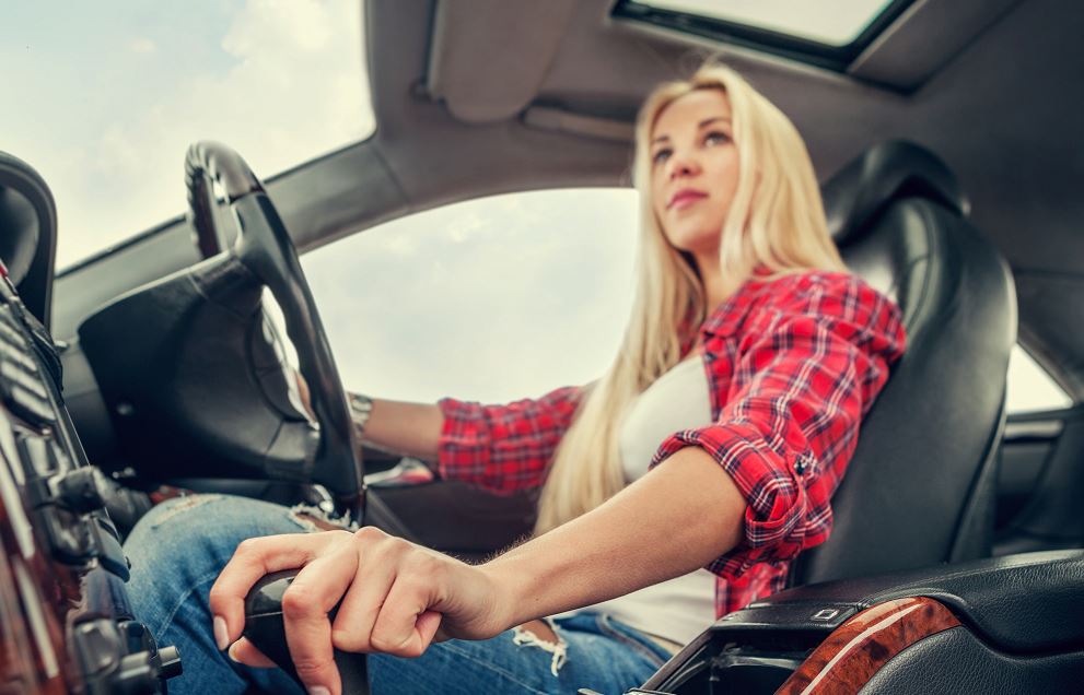 Woman driving a manual car