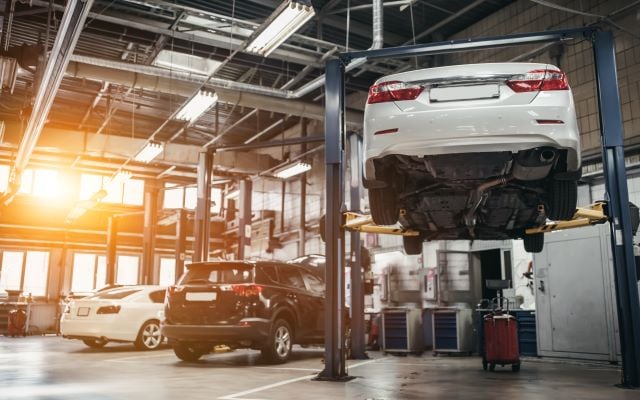 Cars being serviced at a garage