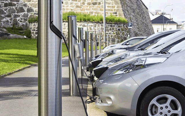 Parked electric cars being charged