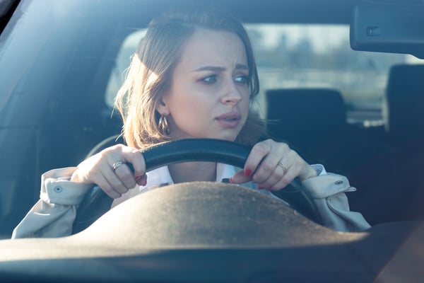 Anxious female driver behind the wheel