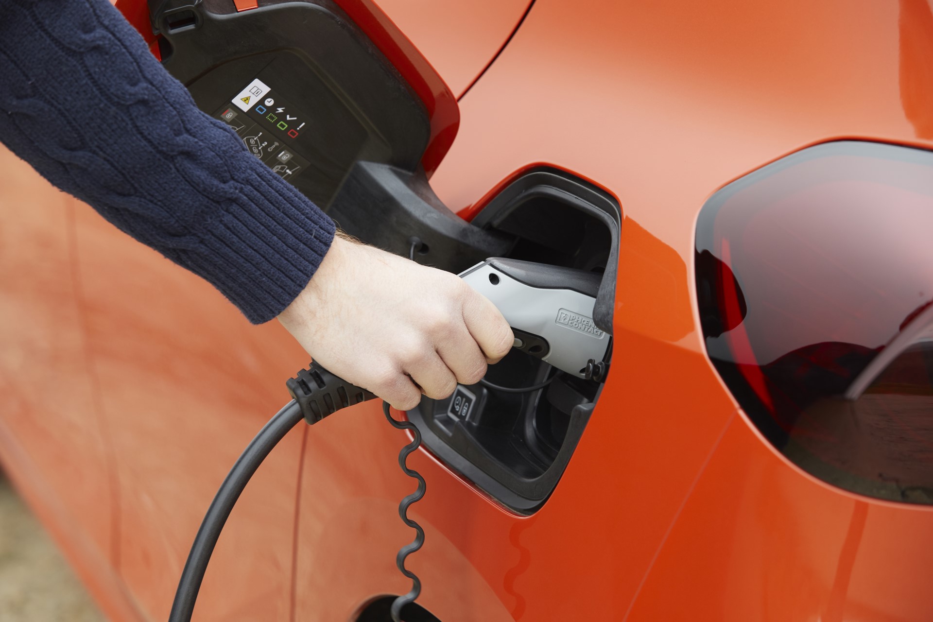 Close up photo of the Vauxhall Corsa E charge port being connected