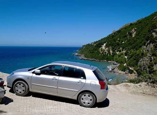 Car parked in sunny country