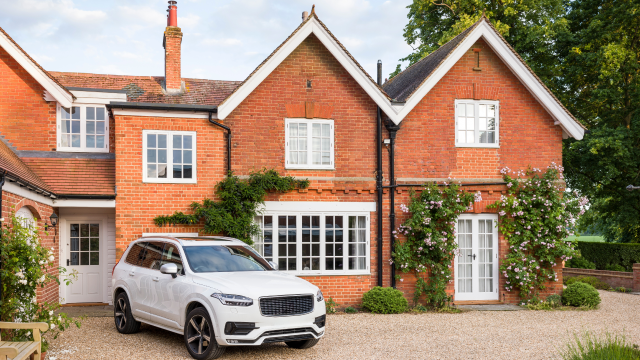 A house with a car parked in the driveway.