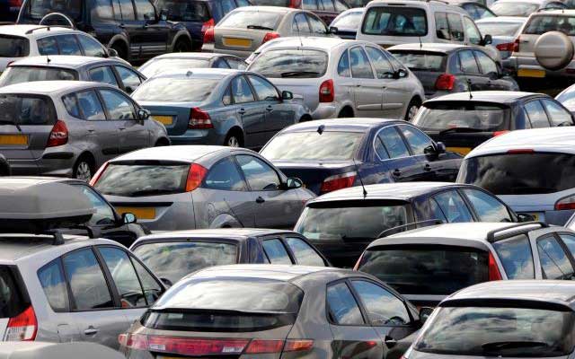 Factors that affect car insurance premiums - a crowded car park full of cars
