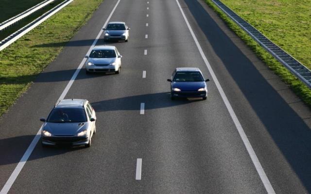 Four cars driving on a motorway